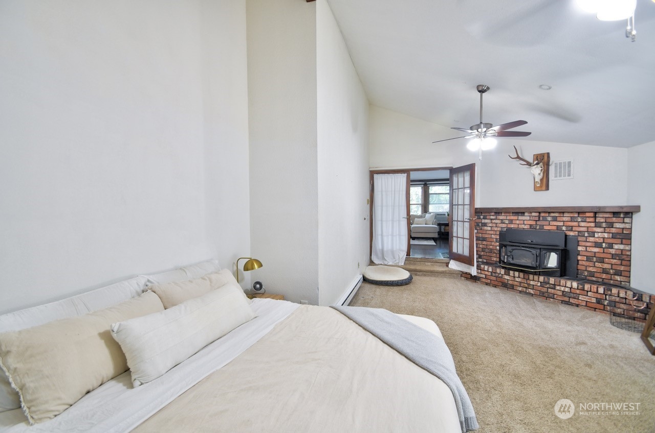 3110 Zenkner Valley Road Centralia, WA 98531 - Photo 21 of 40 a bed room with a bed and a fireplace