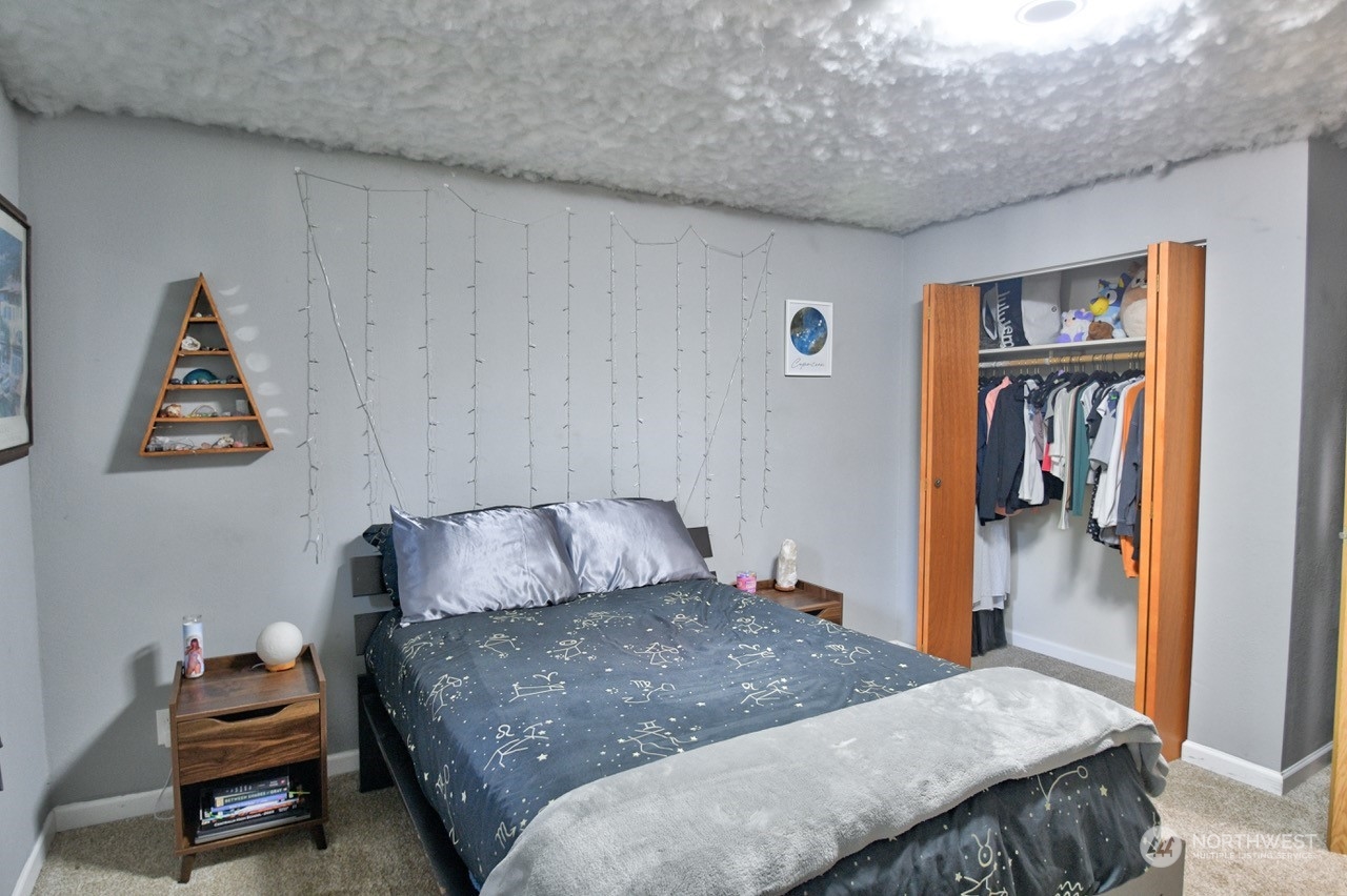 3110 Zenkner Valley Road Centralia, WA 98531 - Photo 26 of 40 a bedroom with a bed and a cabinet