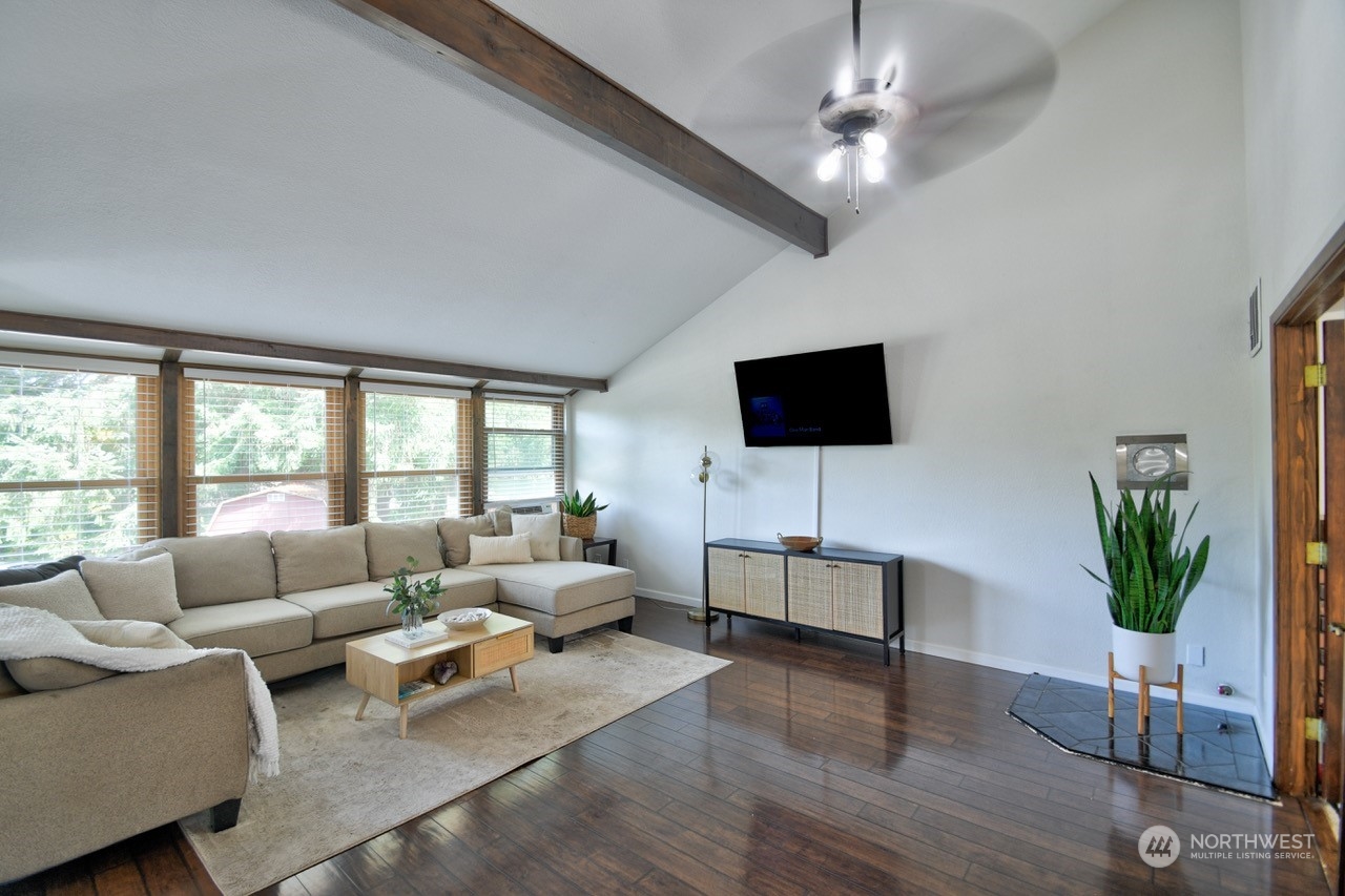 3110 Zenkner Valley Road Centralia, WA 98531 - Photo 8 of 40 a living room with furniture a flat screen tv and a large window