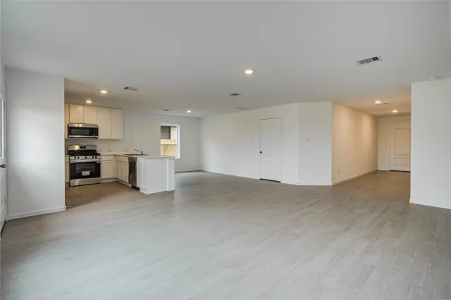 a view of kitchen and refrigerator