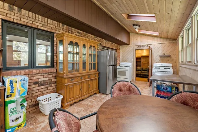 a front view of a house with outdoor seating