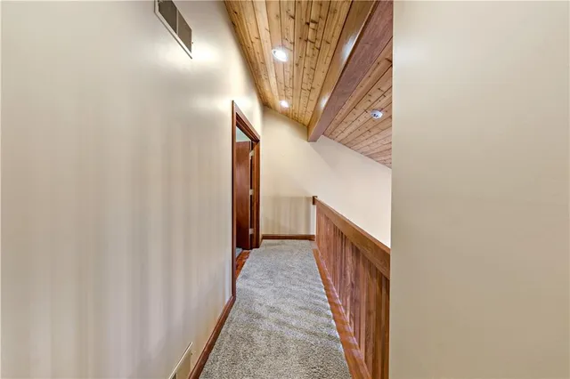 a room with furniture gym equipment and a window