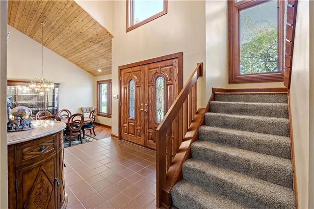 a view of a livingroom with furniture and stairs