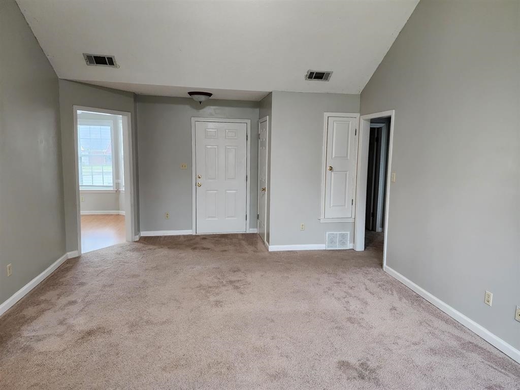 255 Windy Ridge Cove Collierville, TN 38017 - Photo 4 of 21 Unfurnished bedroom featuring vaulted ceiling and light carpet
