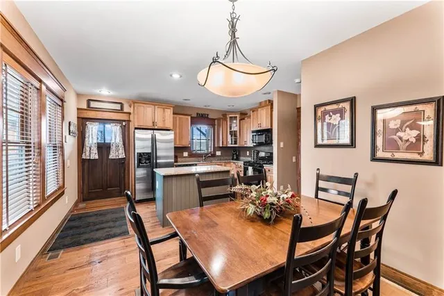 a view of a dining room with furniture window and wooden floor