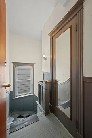 a view of a door and chair in a room
