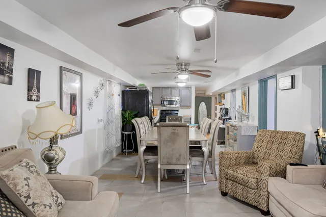 a view of a livingroom with furniture and a chandelier