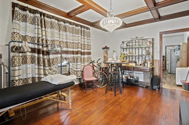 a work room with furniture and wooden floor