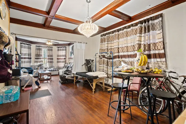 a living room with lots of furniture and a large window