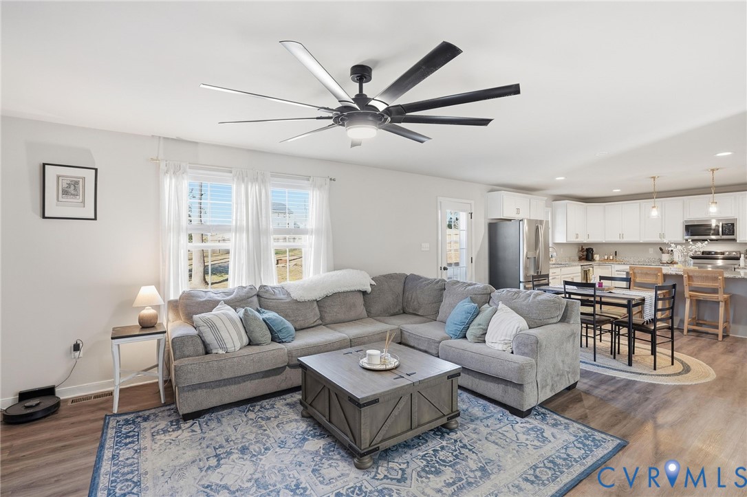 8494 Scouts Road Quinton, VA 23141 - Photo 12 of 27 Living room with dark wood-style floors, recessed