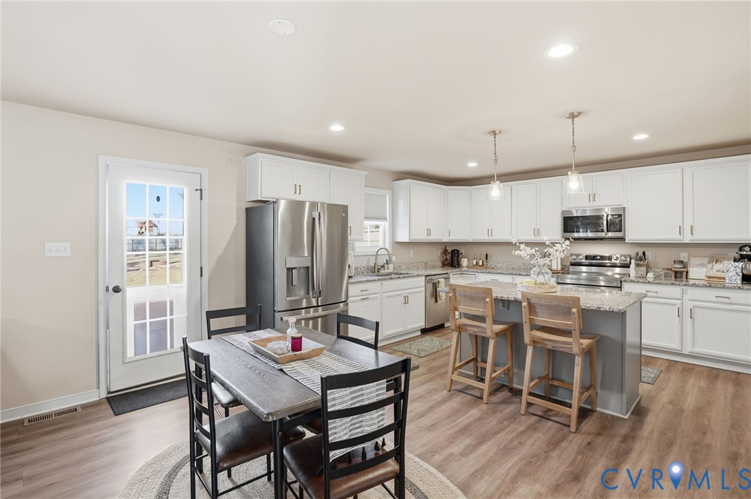 8494 Scouts Road Quinton, VA 23141 - Photo 13 of 27 Dining room with light wood-style floors and reces