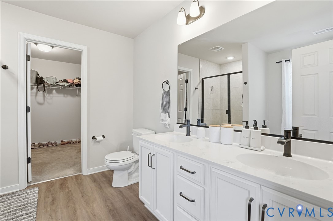 8494 Scouts Road Quinton, VA 23141 - Photo 19 of 27 Full bathroom with a spacious closet, a shower sta