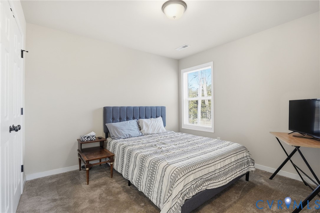 8494 Scouts Road Quinton, VA 23141 - Photo 23 of 27 Bedroom with carpet flooring and baseboards