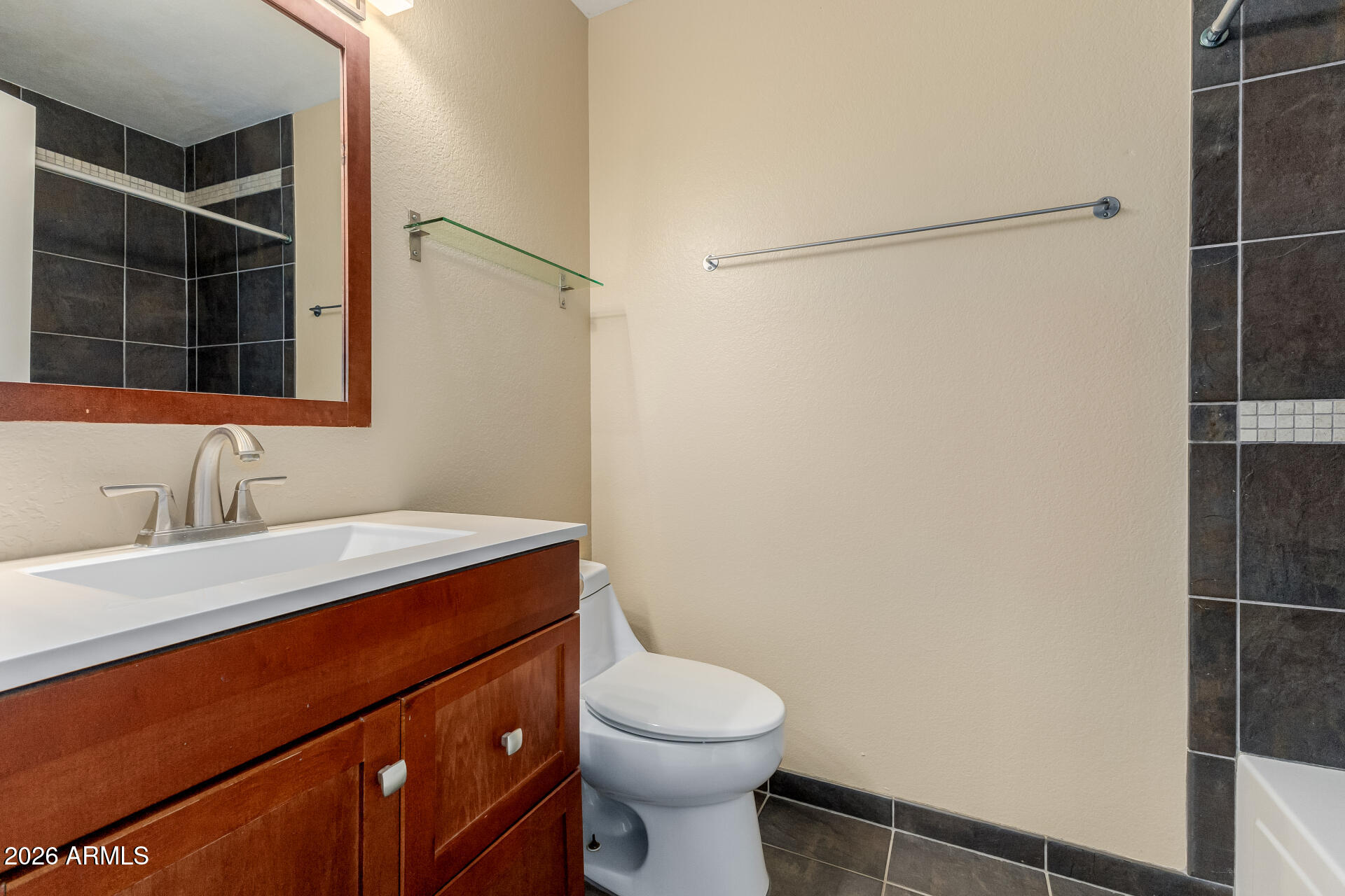 4843 East Corral Road, Unit 4 Phoenix, AZ 85044 - Photo 17 of 36 a bathroom with a sink a toilet and shower