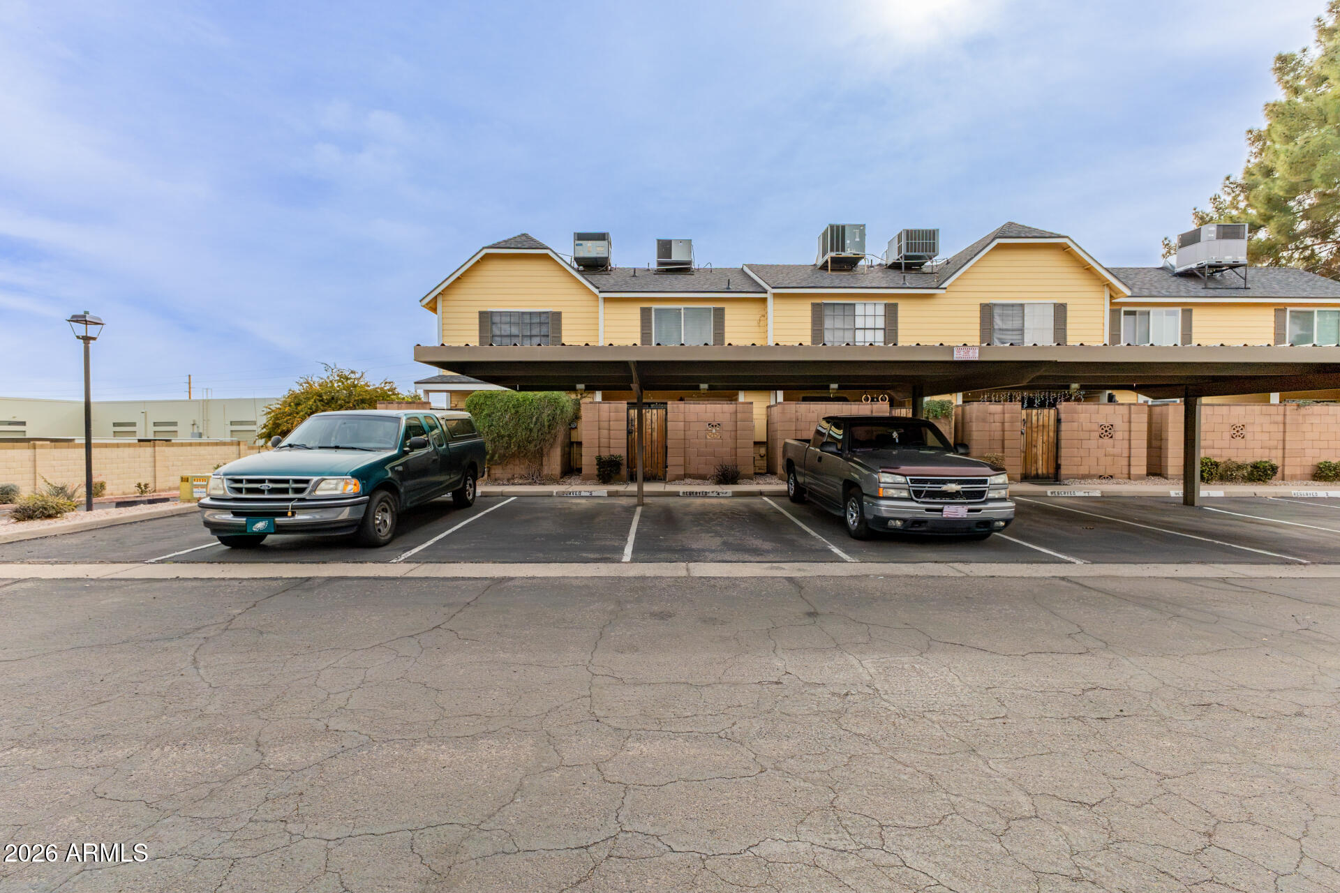 4843 East Corral Road, Unit 4 Phoenix, AZ 85044 - Photo 23 of 36 a car parked in front of a house