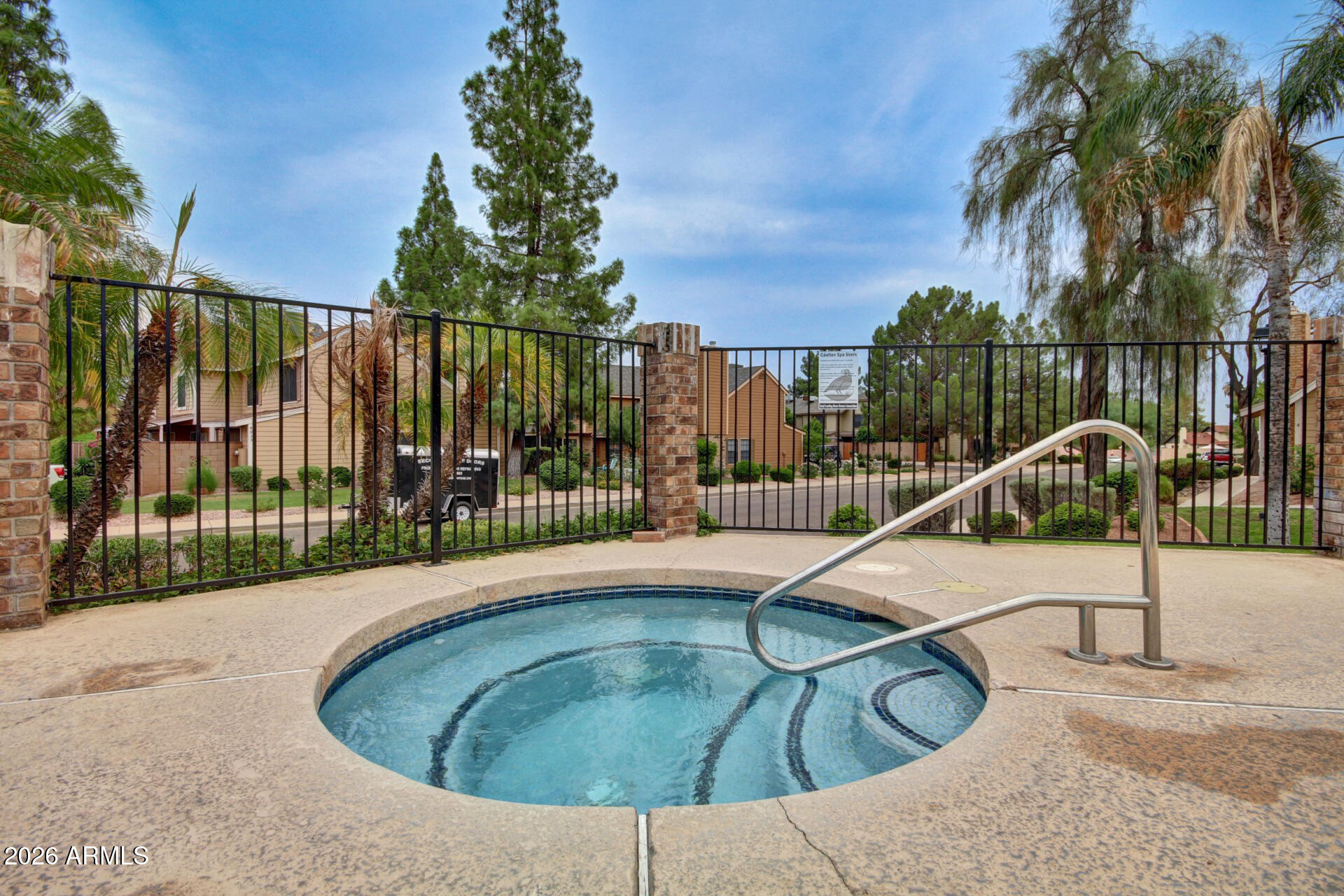 4843 East Corral Road, Unit 4 Phoenix, AZ 85044 - Photo 25 of 36 a view of a swimming pool with a lounge chair