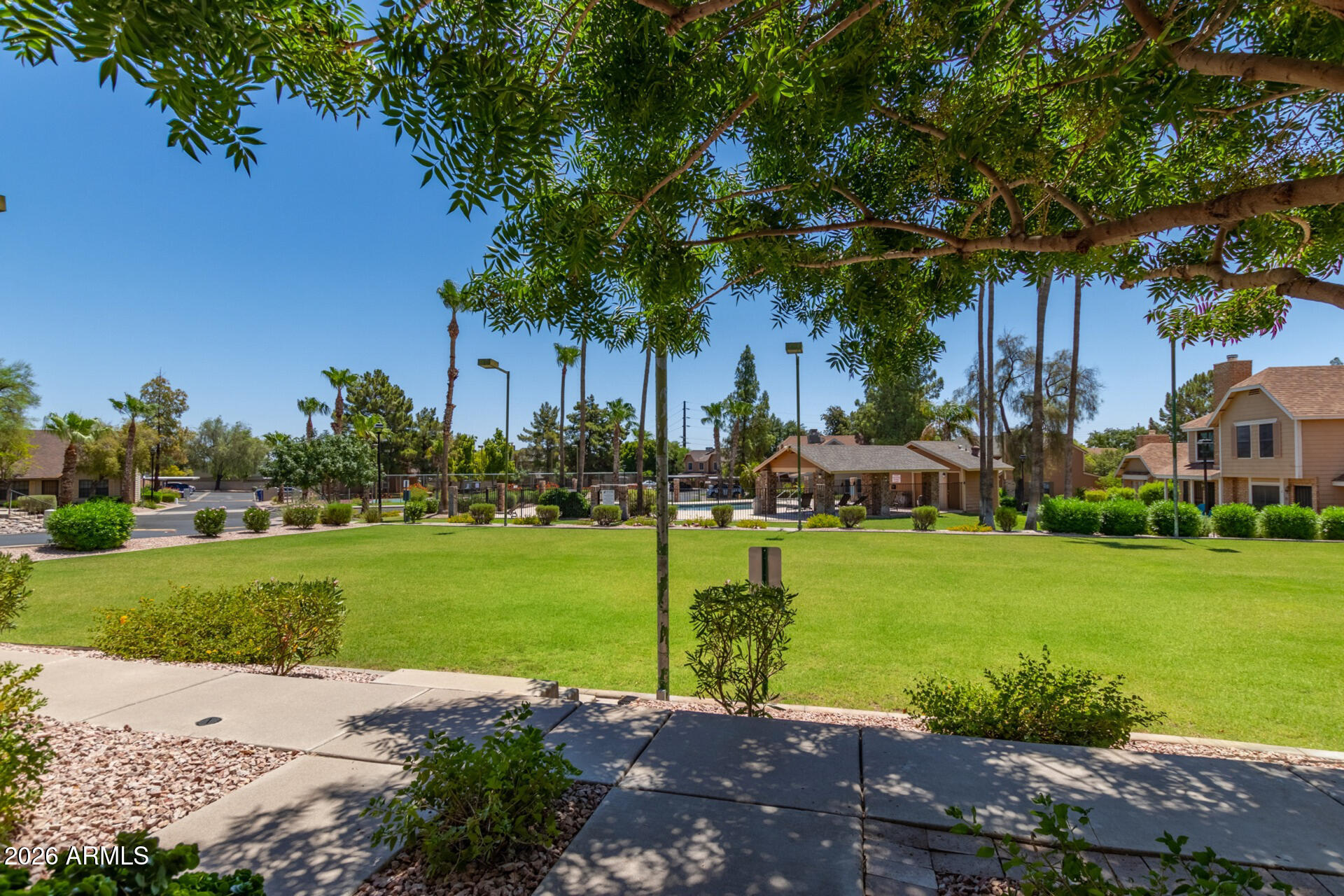 4843 East Corral Road, Unit 4 Phoenix, AZ 85044 - Photo 30 of 36 a front view of a house with garden