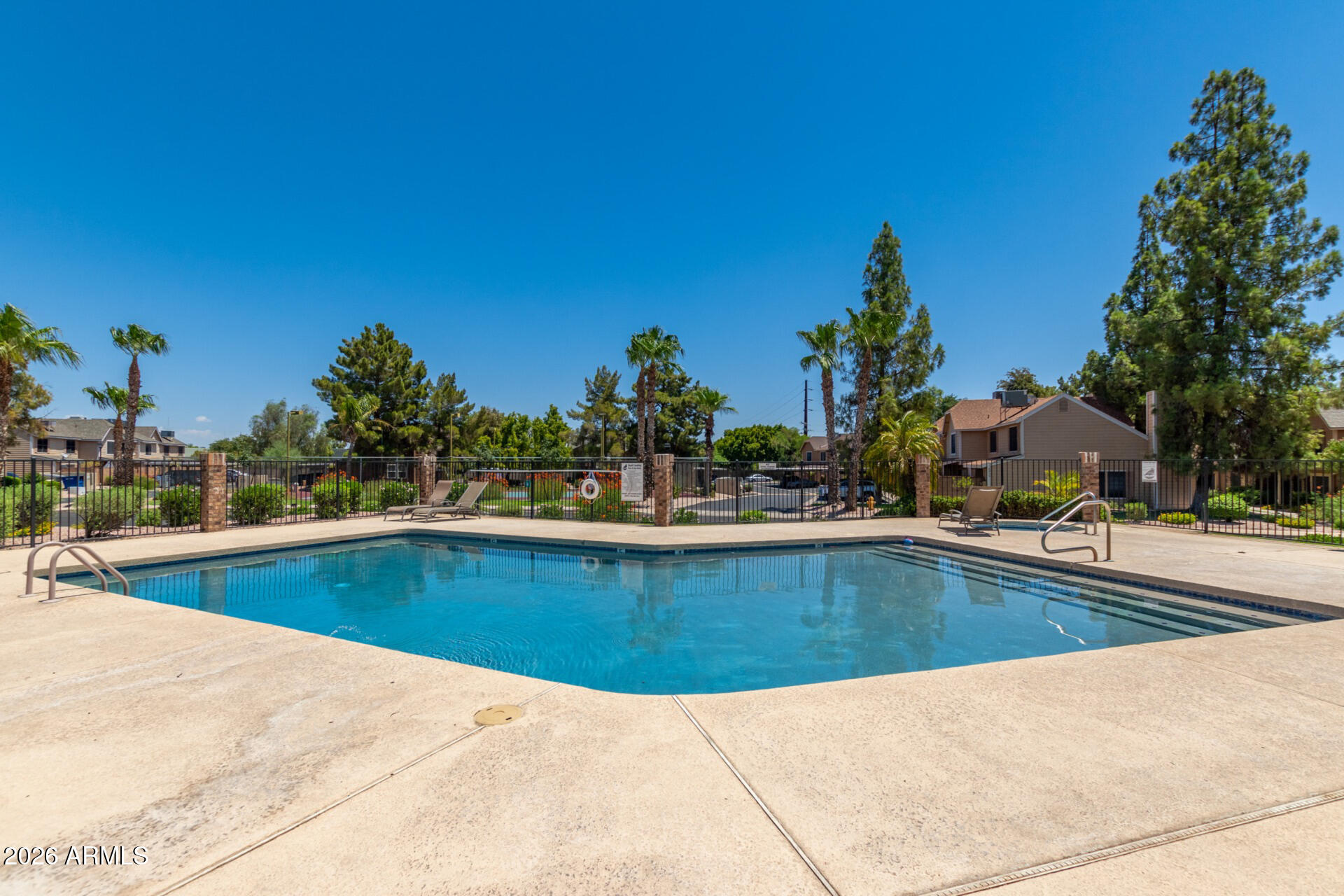 4843 East Corral Road, Unit 4 Phoenix, AZ 85044 - Photo 33 of 36 a view of a swimming pool and a outdoor space