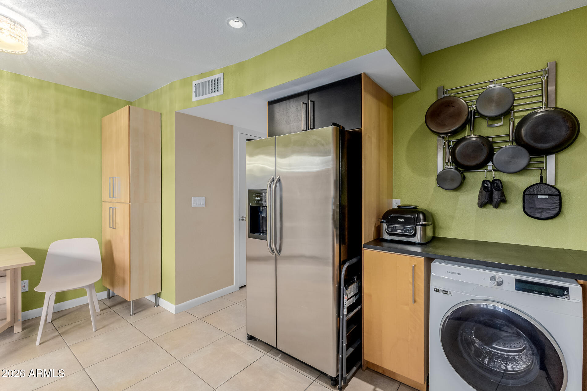 4843 East Corral Road, Unit 4 Phoenix, AZ 85044 - Photo 9 of 36 a kitchen with a refrigerator and a stove top oven