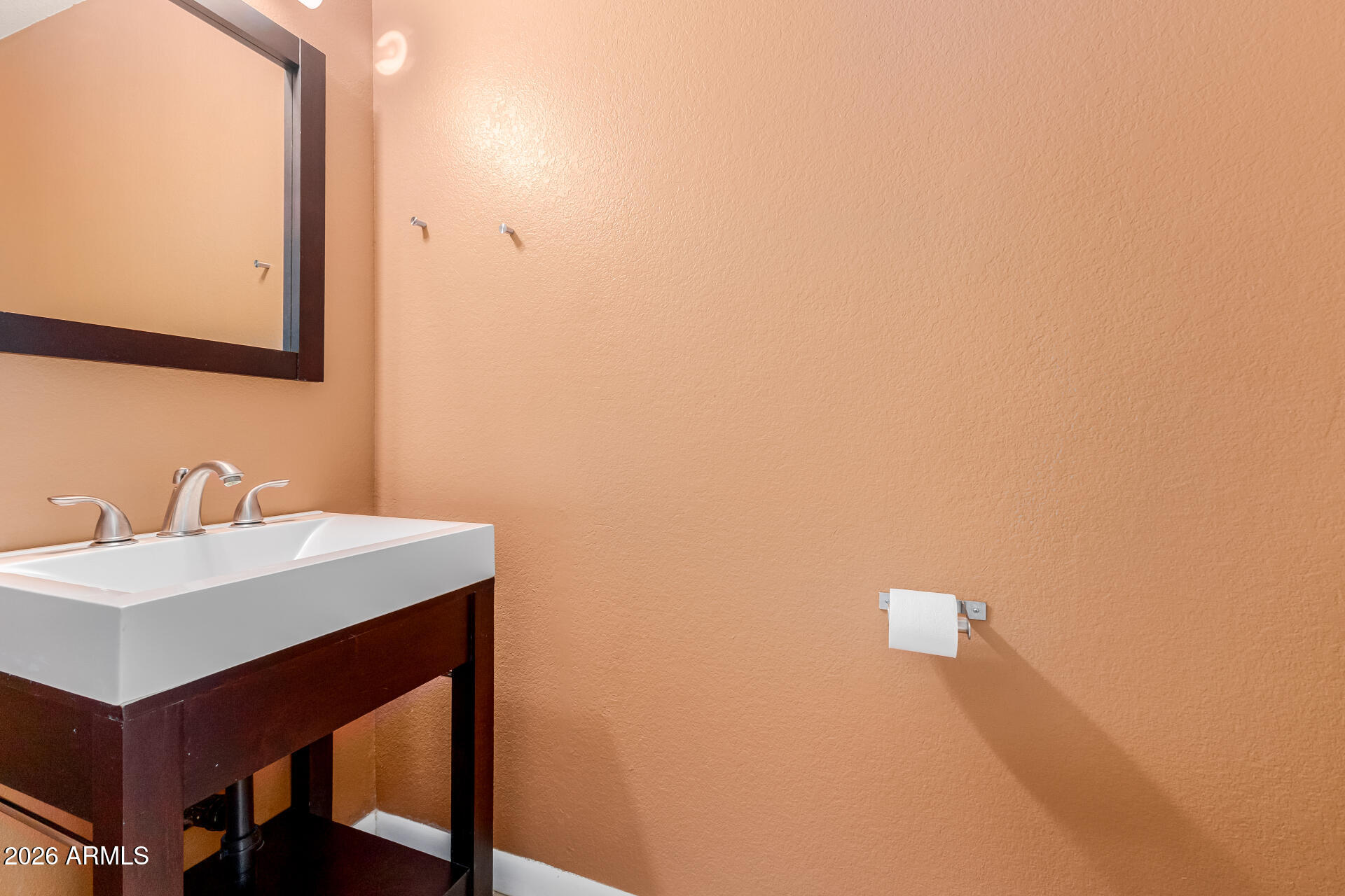 4843 East Corral Road, Unit 4 Phoenix, AZ 85044 - Photo 10 of 36 a bathroom with a sink and a mirror