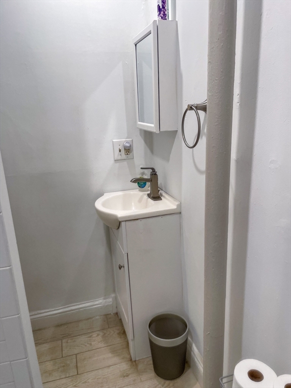 34 East Newton Street, Unit 2 Boston, MA 02118 - Photo 7 of 7 a bathroom with a sink and a mirror