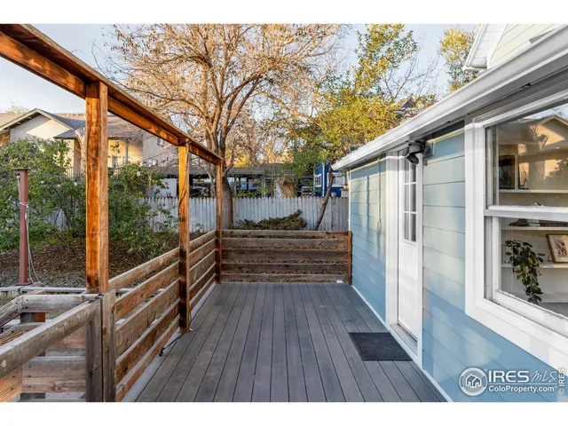 a backyard of a house with barbeque oven