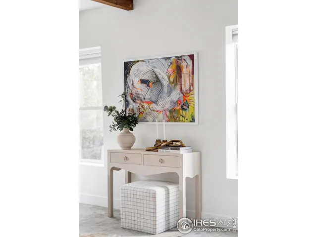 a living room with furniture a rug and a fireplace