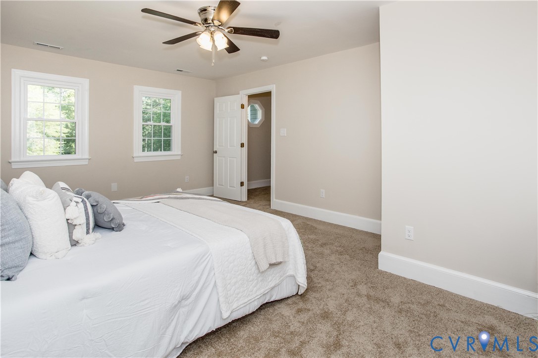 13110 Hensley Road Midlothian, VA 23112 - Photo 17 of 24 a bedroom with a bed and a window