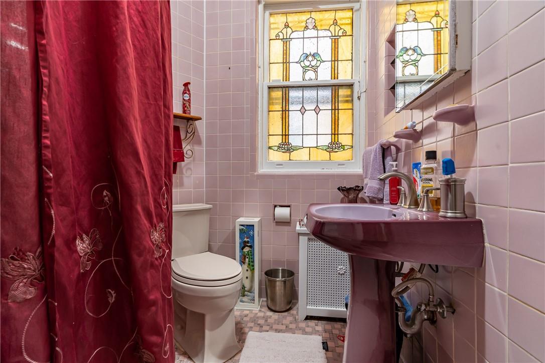 2744 Kingsbridge Terrace Bronx, NY 10463 - Photo 16 of 36 Unit 1 Bathroom 1 with stained glass window