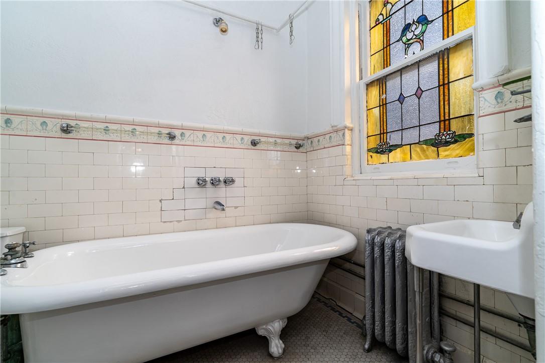 2744 Kingsbridge Terrace Bronx, NY 10463 - Photo 25 of 36 Unit 2 bathroom with stained glass window