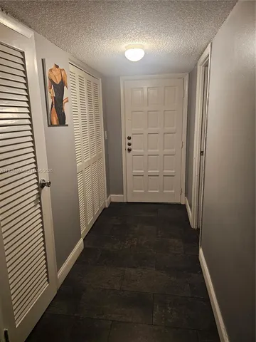 a kitchen with stainless steel appliances granite countertop a sink and a stove