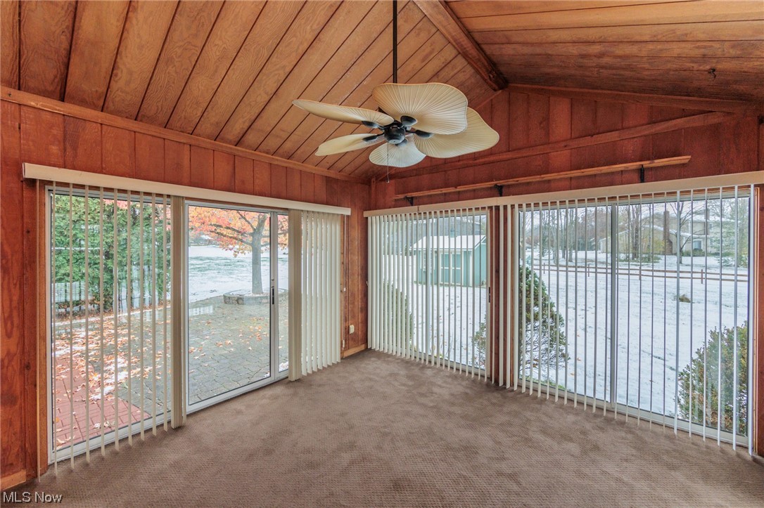 36085 Bainbridge Road Solon, OH 44139 - Photo 9 of 35 Unfurnished sunroom with lofted ceiling, ceiling fan, and wood ceiling