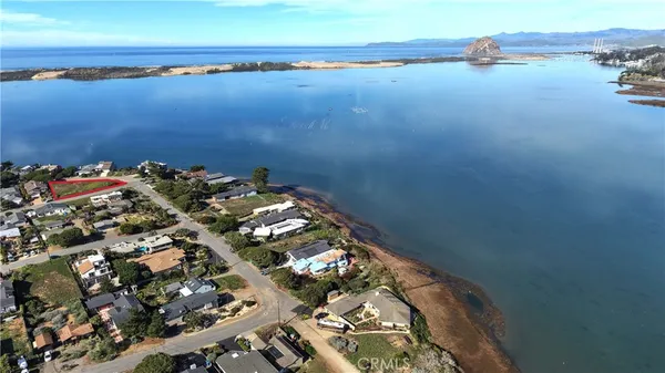 a tall building with lake view