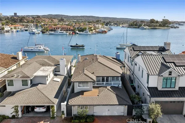 an aerial view of a house with a ocean view