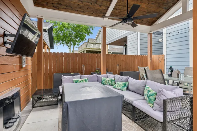 a view of an outdoor sitting area with furniture