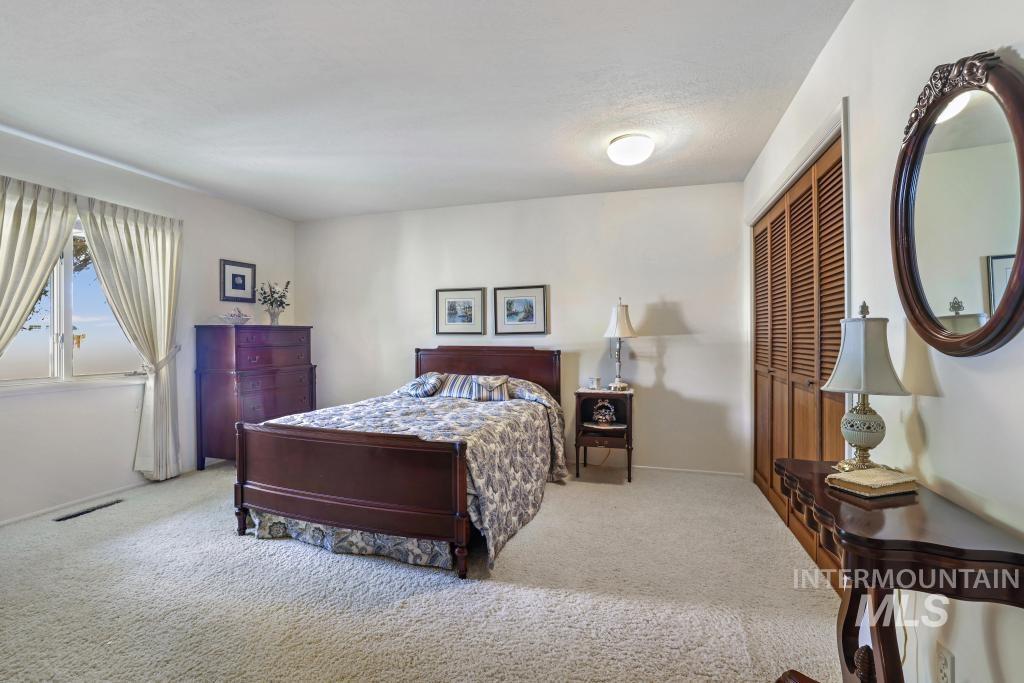 2018 Rancho Vista Drive Twin Falls, ID 83301 - Photo 27 of 50 Spacious bedroom featuring light-colored carpeting and white painted walls