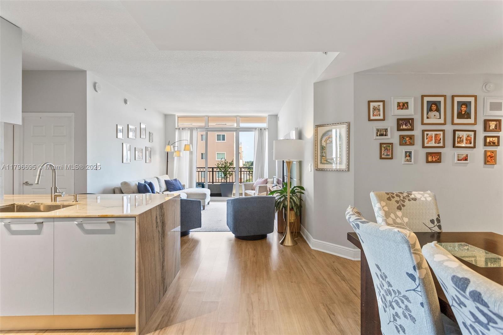 3232 Southwest 22nd Street, Unit 601 Miami, FL 33145 - Photo 1 of 38 a living room with furniture and wooden floor