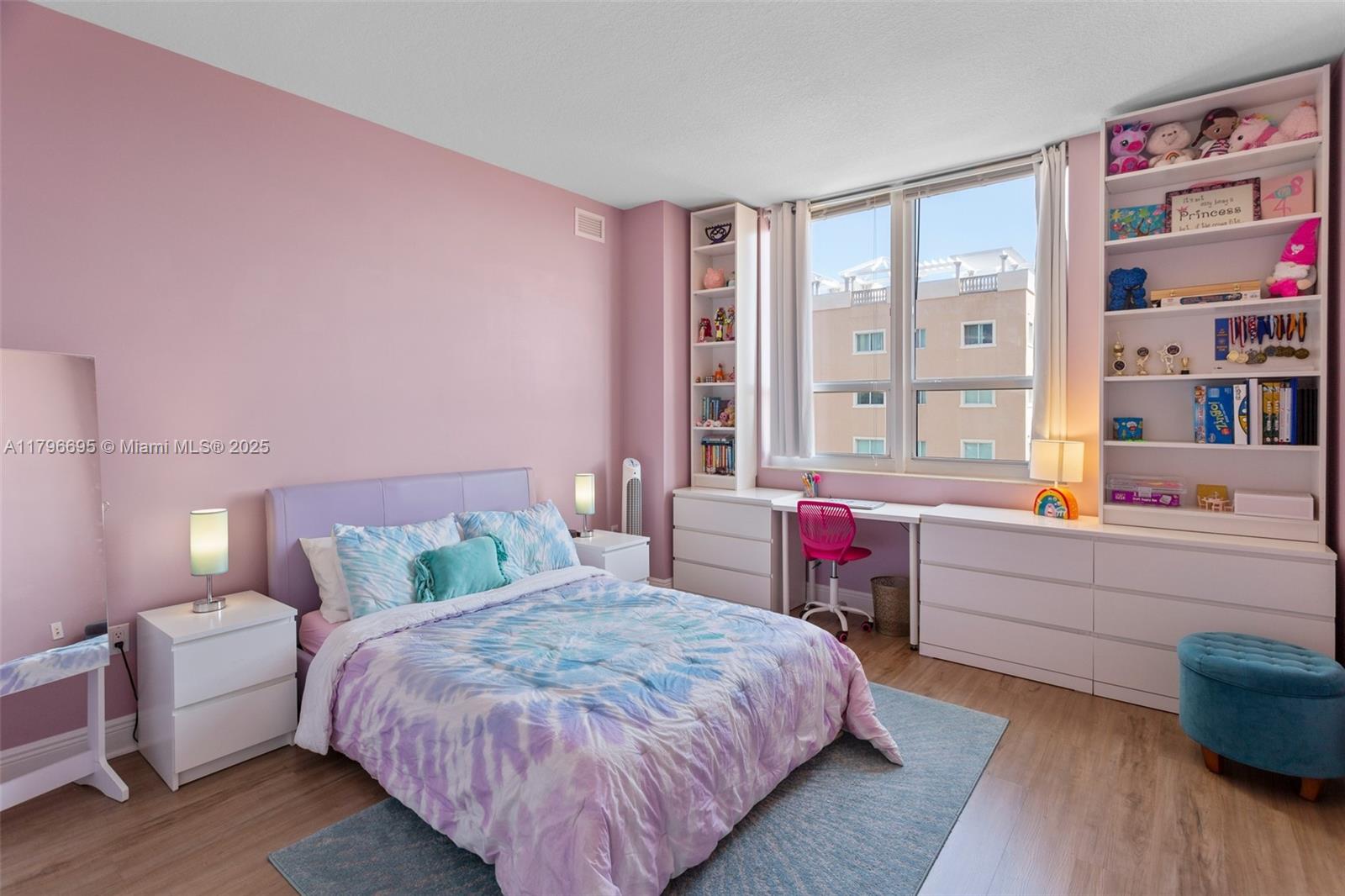 3232 Southwest 22nd Street, Unit 601 Miami, FL 33145 - Photo 12 of 38 a bedroom with a bed and a cabinets