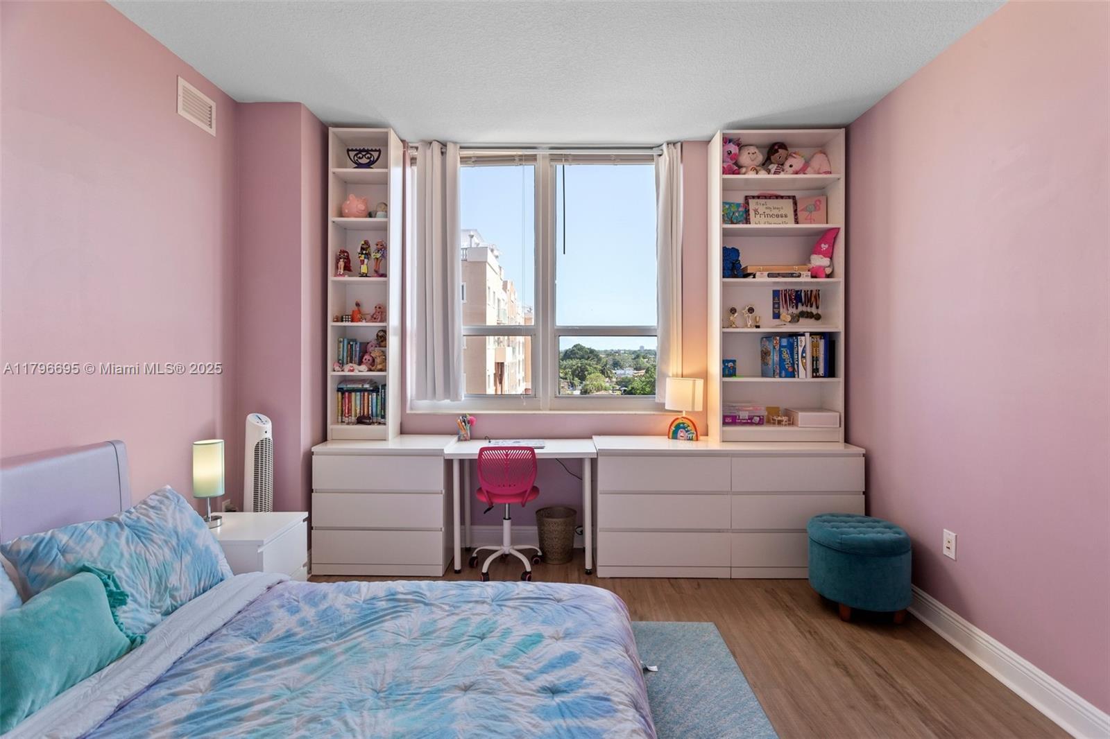 3232 Southwest 22nd Street, Unit 601 Miami, FL 33145 - Photo 14 of 38 a bedroom with a bed and a large window