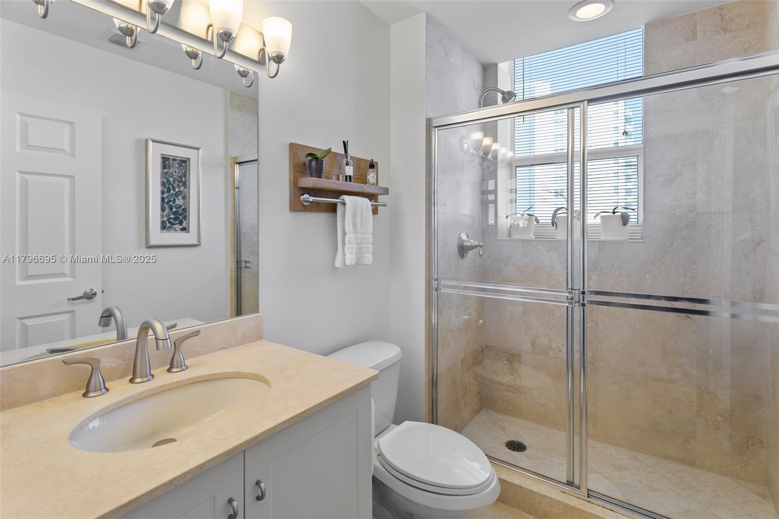 3232 Southwest 22nd Street, Unit 601 Miami, FL 33145 - Photo 16 of 38 a bathroom with a sink toilet and shower