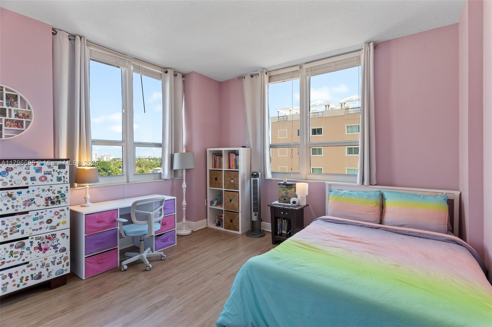 3232 Southwest 22nd Street, Unit 601 Miami, FL 33145 - Photo 17 of 38 a bedroom with a bed and wooden floor