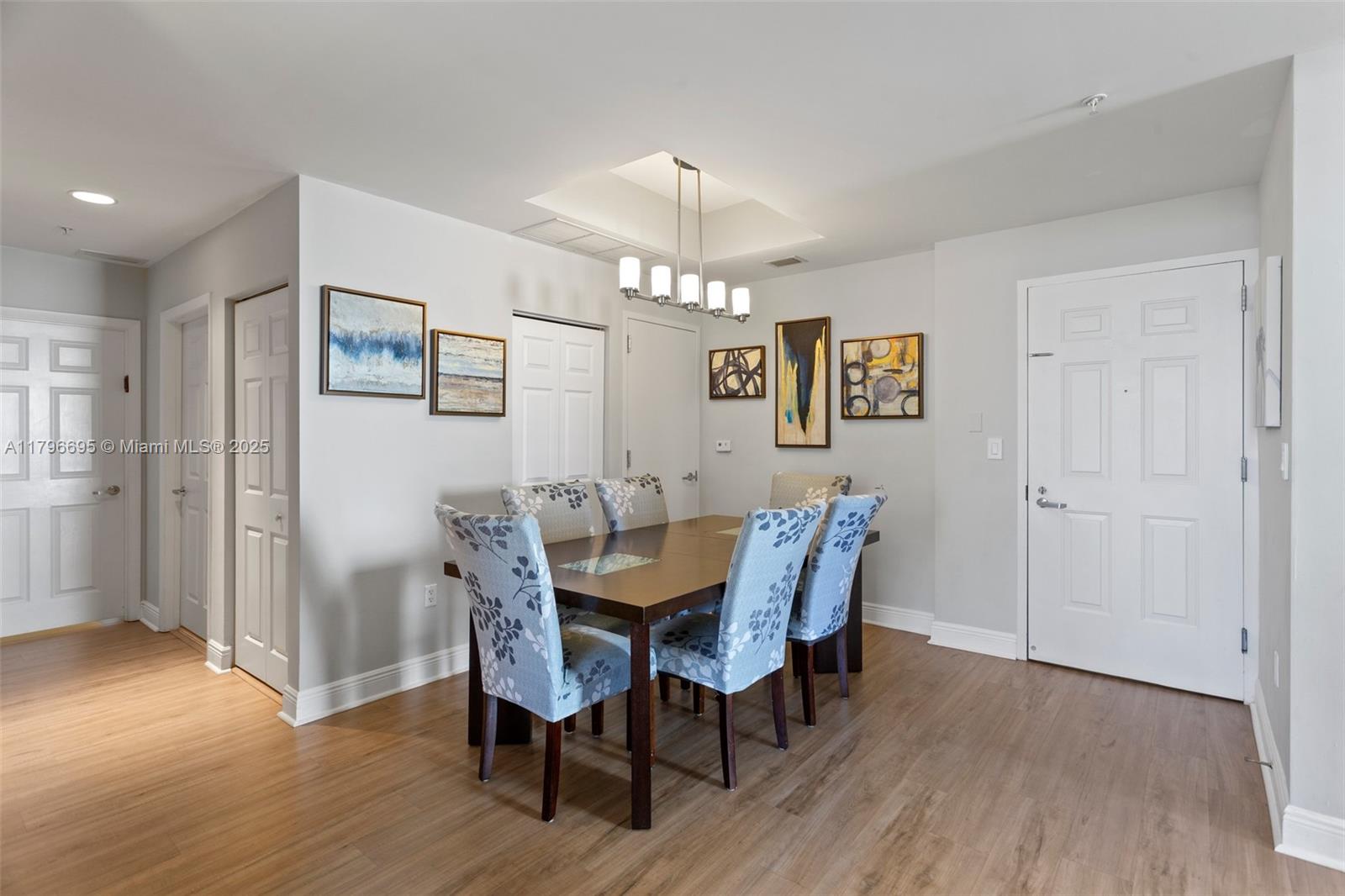 3232 Southwest 22nd Street, Unit 601 Miami, FL 33145 - Photo 4 of 38 a view of a dining room with furniture window and wooden floor