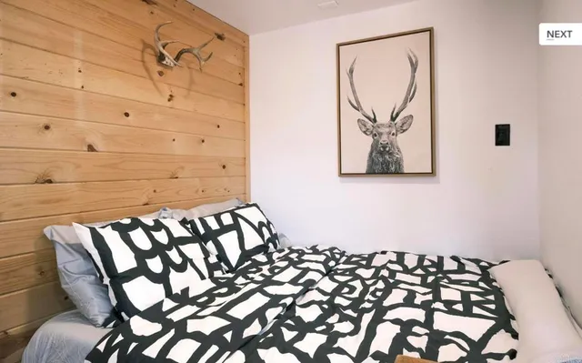 a view of a street sign under a tree