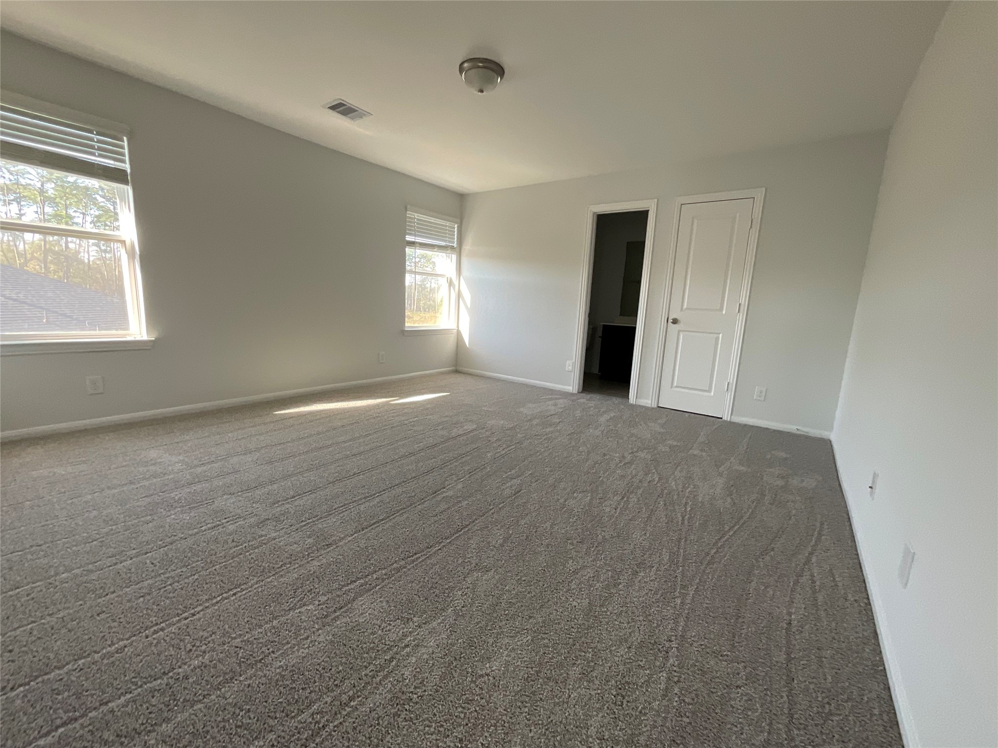 8039 Brooks Crossing Drive Baytown, TX 77521 - Photo 14 of 24 a view of an empty room with window and closet area