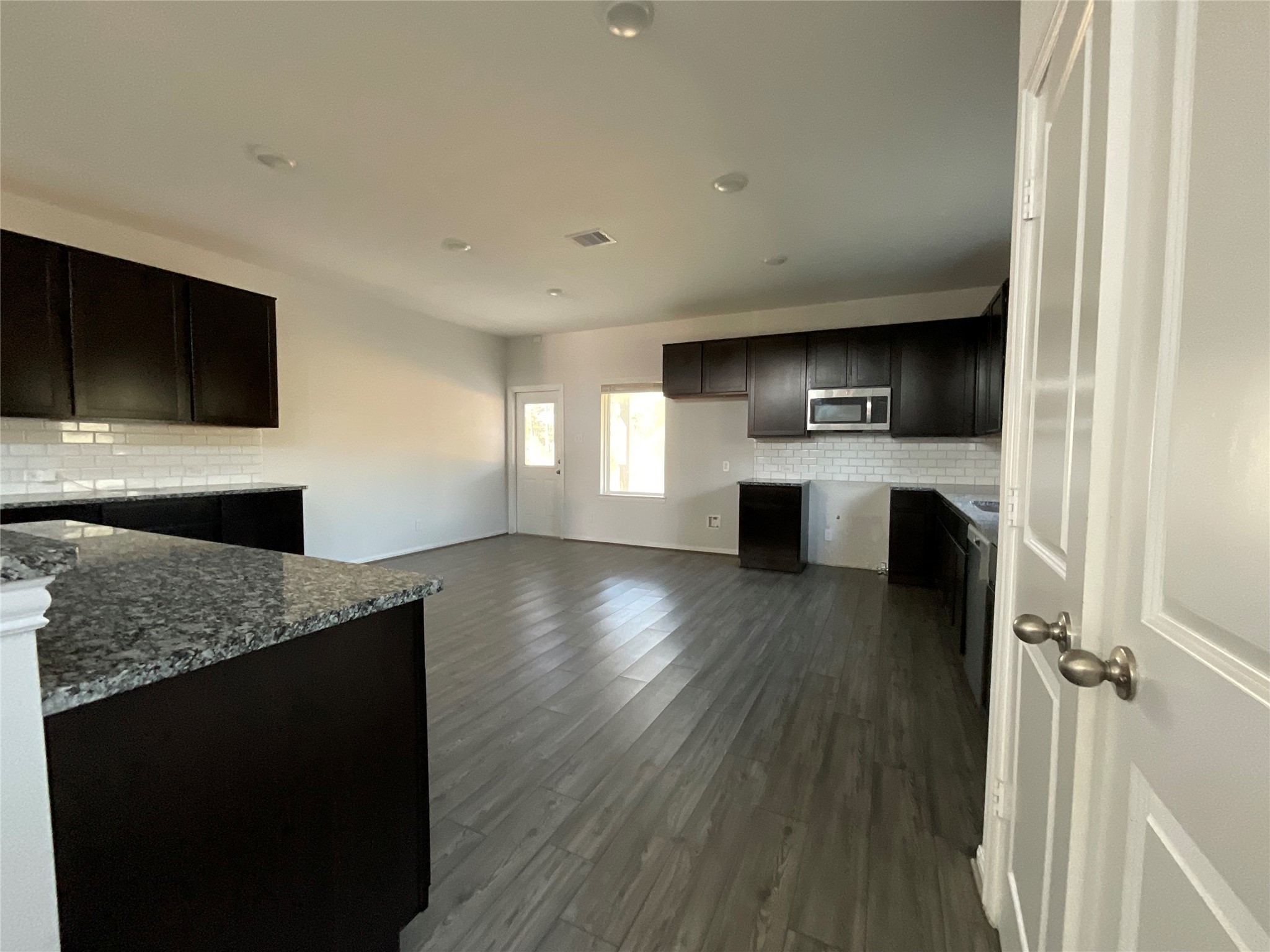 8039 Brooks Crossing Drive Baytown, TX 77521 - Photo 7 of 24 a kitchen with a refrigerator and a sink