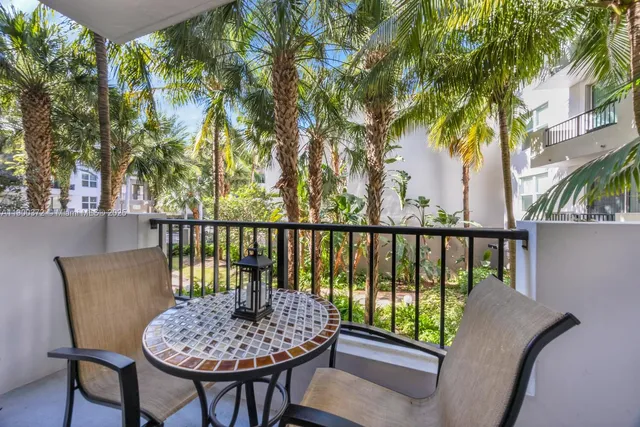 a view of a chairs and table in patio