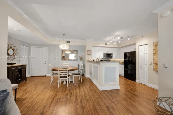 a kitchen with a table and chairs in it