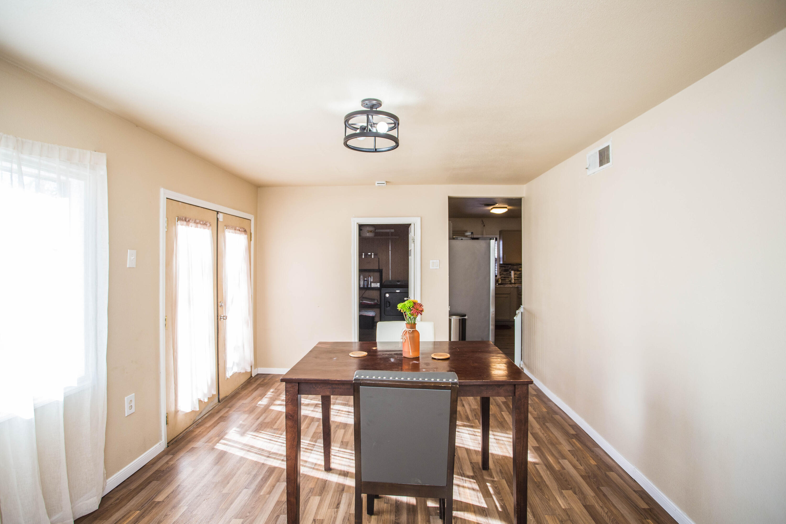 2103 30th Street Lubbock, TX 79411 - Photo 13 of 15 a view of a dining room with furniture and wooden floor