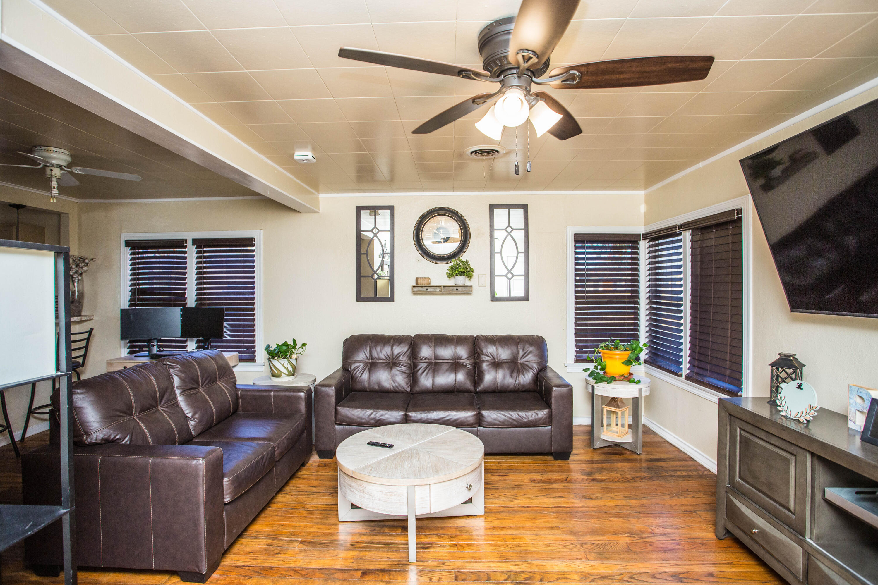 2103 30th Street Lubbock, TX 79411 - Photo 4 of 15 a living room with furniture and a flat screen tv