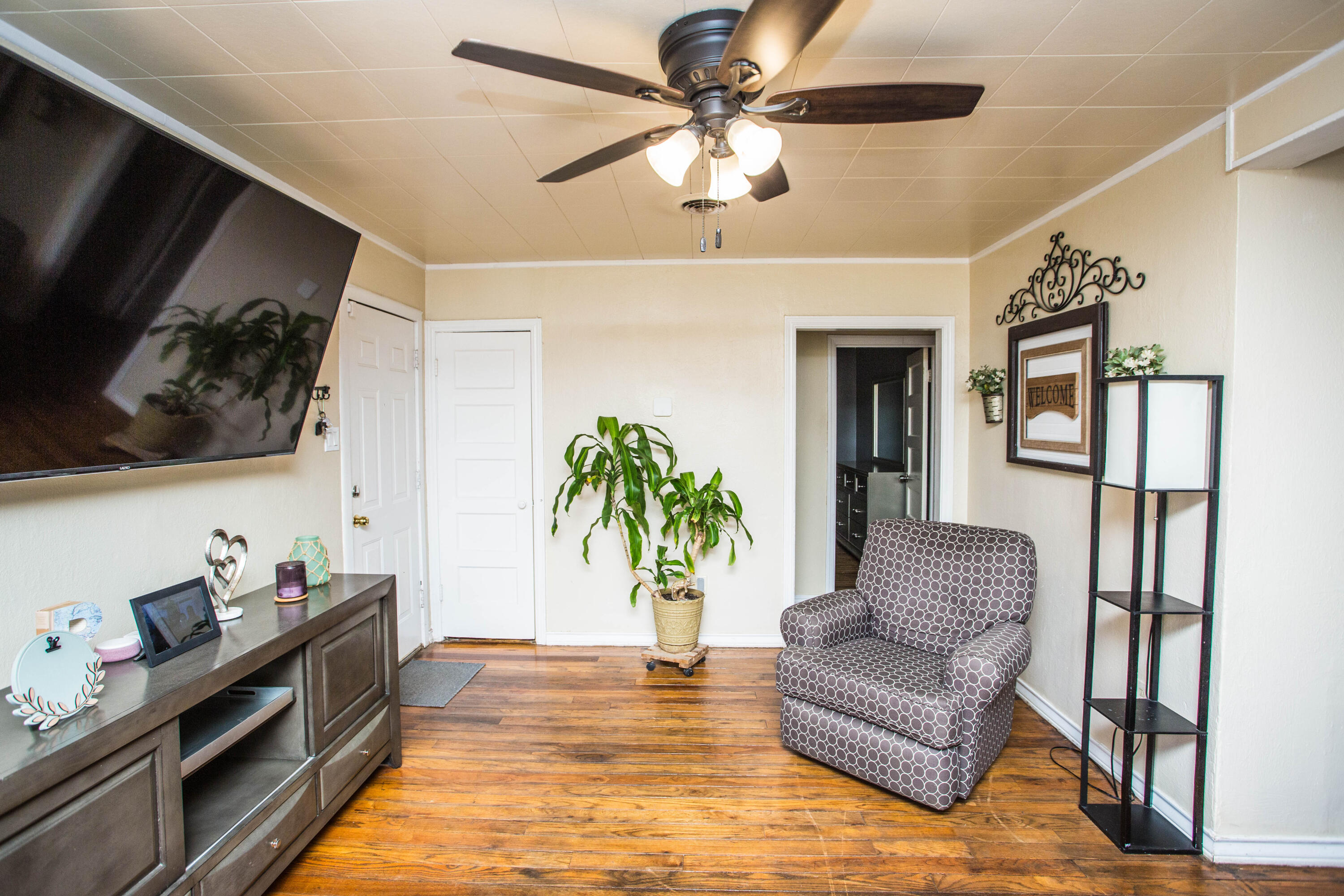 2103 30th Street Lubbock, TX 79411 - Photo 5 of 15 a living room with furniture and a flat screen tv